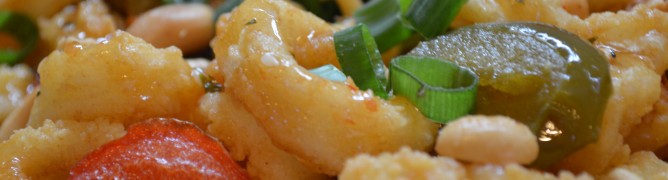 Close-up of a colorful stir-fried shrimp dish with vegetables.